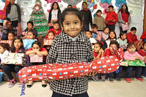 An illustration of items donors provide: a book, a first aid kit, clothing, and canned food.